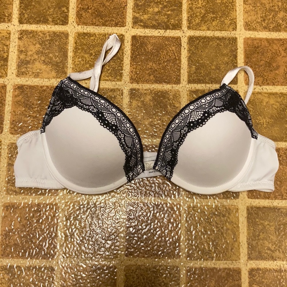 Bra size 34B, white with black lace.